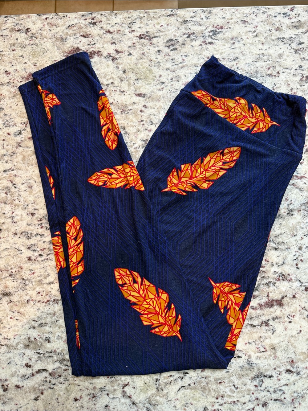 LuLaRoe Navy Leggings with Orange Feather Print